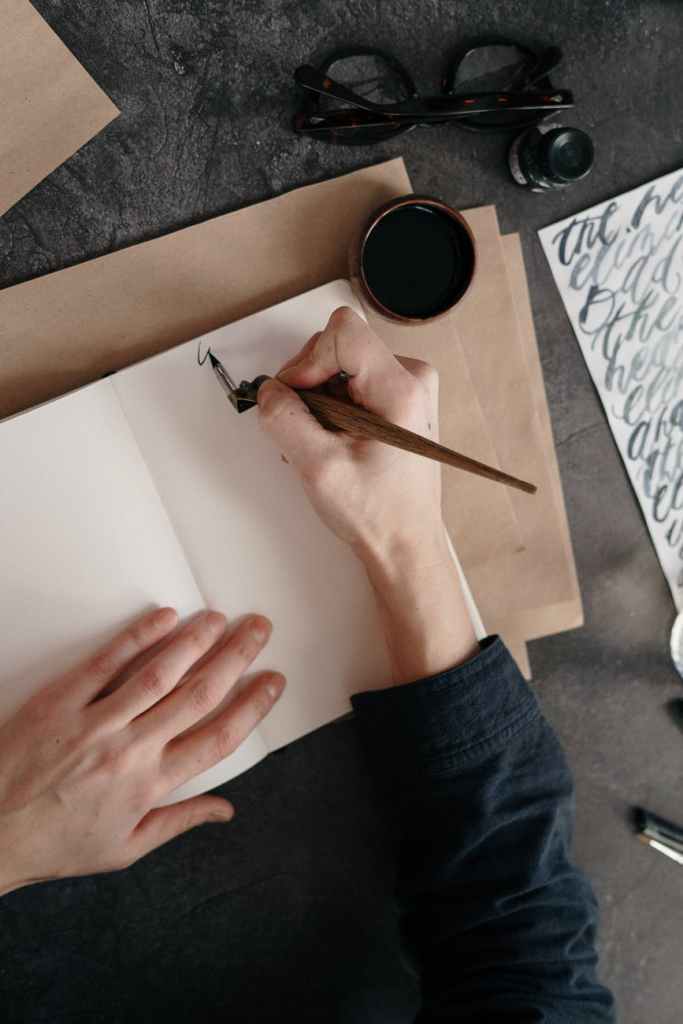 Person Writing with Ink